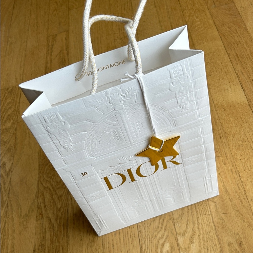 Dior empty shopping bag, gold star accessory. From glasses purchased in Paris.